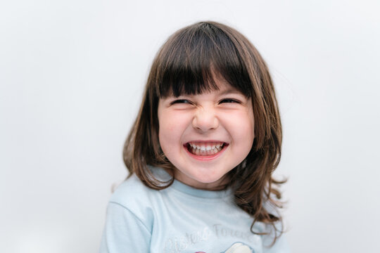 Happy little girl laughing portrait