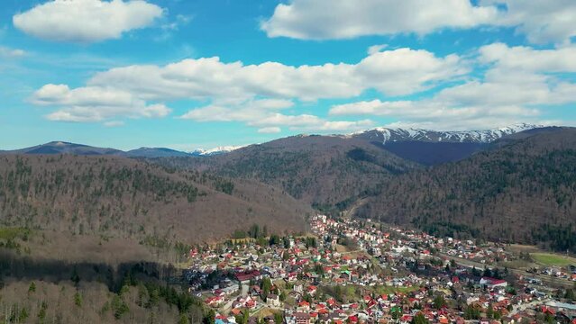 Aerial shot of the cityscape of the mountain town of Busteni in the north of Prahova, Romania