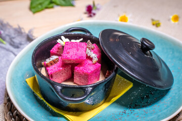 food sitting in a blue dish on top of a table