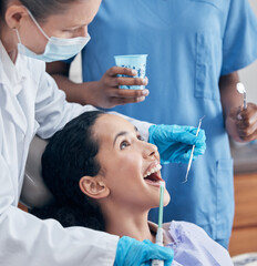 Woman, dentist and mouth for cleaning, dental hygiene and oral care in clinic. Female person,...
