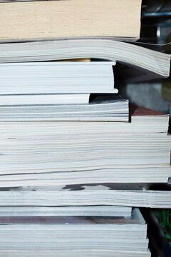 Close-up of colorful books and magazines with hard direct flashlight