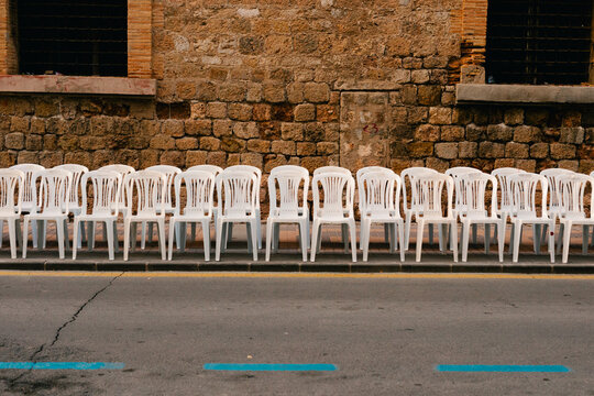 empty chairs in holy week procession in Cartagena, Spain.