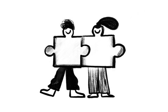 man and woman puzzle pieces coming together.Unity, love, partnership
