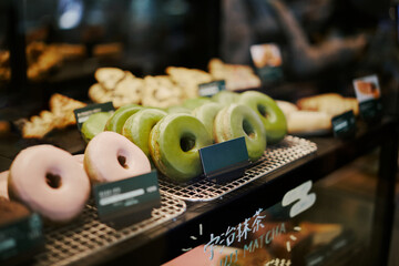 Matcha Green Tea Donuts In A Display Case At A Shop In Uji, Japan.