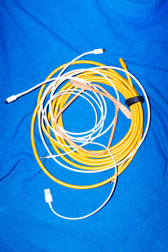 Colorful wires on blue background with direct flashlight