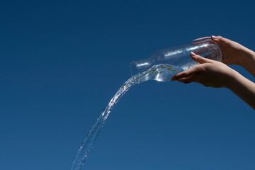 Water pouring  from jug