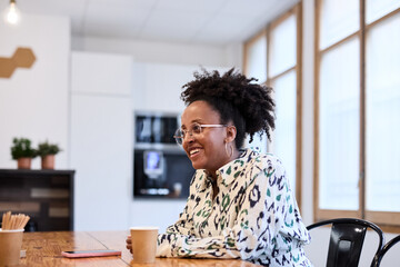 Smiling businesswoman during her break at business office