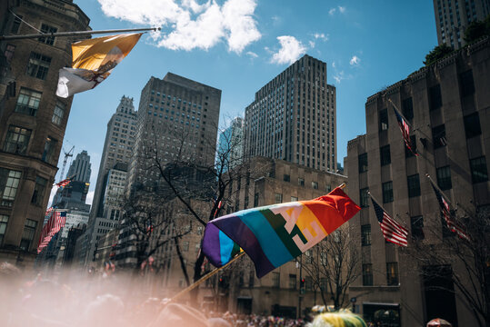Pride Flag Waving in Urban Setting