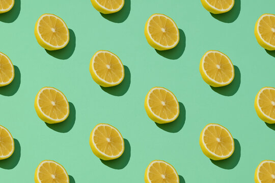 Trendy sunlight Summer pattern made with yellow lemon slices