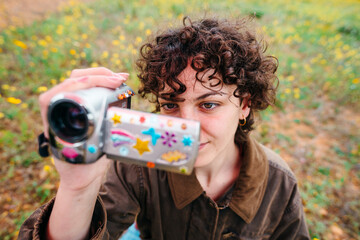 Woman filming outdoors