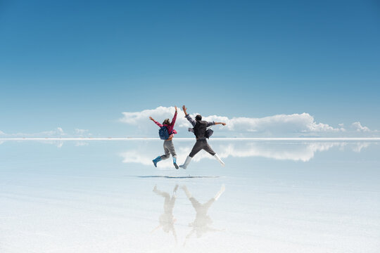 travel couple in amazing landscape of uyuni