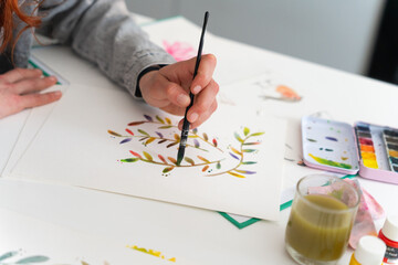 Anonymous Woman Painting A Illustration At Home.