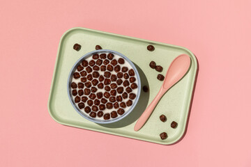 Choco chocolate balls breakfast cereal on pink background
