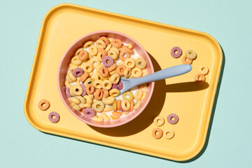 Colorful rings / loops breakfast cereal on blue background