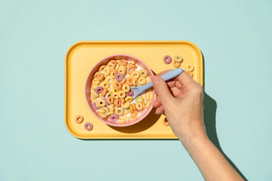 Colorful rings / loops breakfast cereal on blue background