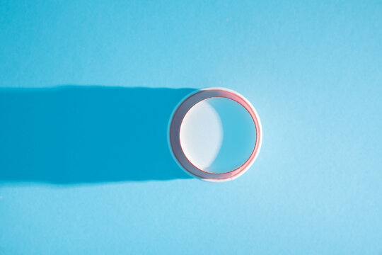 Empty Red Paper Cup on Blue Background