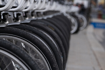 City bikes rental. Wheel closeup.
