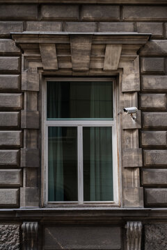 Window in old city center with camera.
