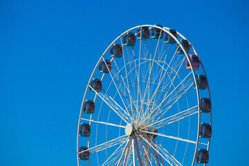 giant wheel sunny day blue sky