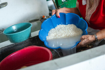 Woman washing rice