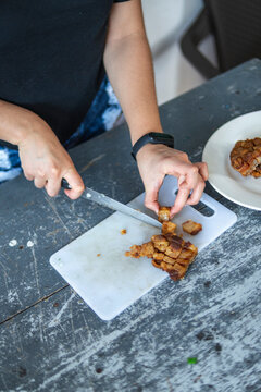Woman chopping chicharron
