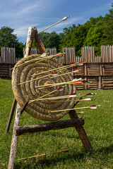 Straw target on a stand. A large number of arrows stuck in a straw target. Close-up of target,...