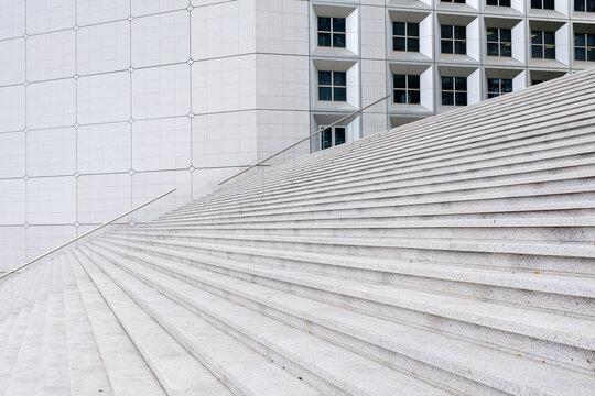 Minimalistic stairs and windows of an office building.