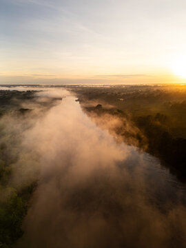 Aerial Sunset View of Amazon Rainforest and River