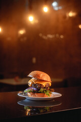 Juicy American burger, hamburger or cheeseburger with two beef patties, with sauce and basked on a...