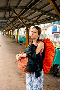 Backpacker girl in Sri Lanka train station