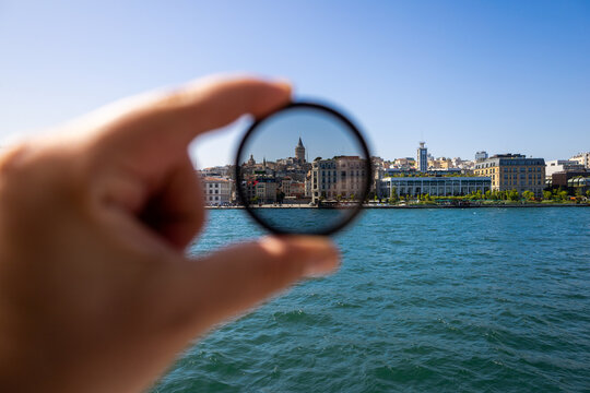 Polarizing filter in action. Polarizing filter for camera lens in photography. Galata tower, part of which was taken with a polarising filter