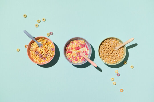 Colorful breakfast cereal on blue background