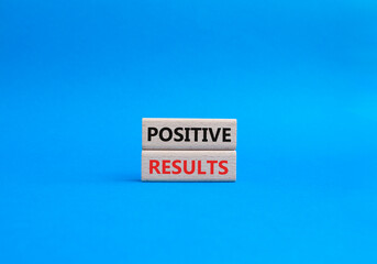 Now Hiring symbol. Concept word Now Hiring on wooden blocks. Beautiful blue background. Business...