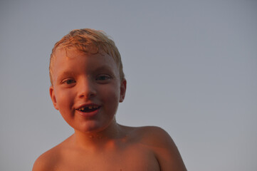 A 6 years old kid on a lake