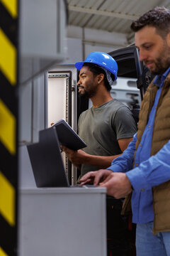Male technician and engineer working in industry