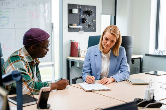 Signing a contract in the office