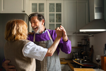Couple dancing in kitchen