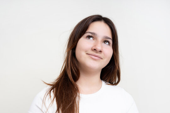 Contemplative Young Woman Looking Upward