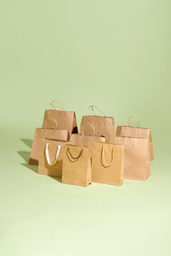 Recycled Shopping Brown paper bag on green background .