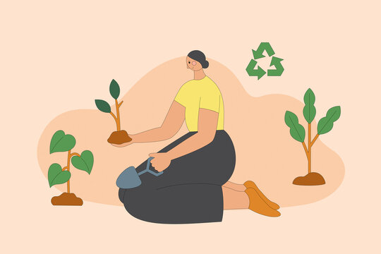 Young eco volunteer girl plants a tree. 