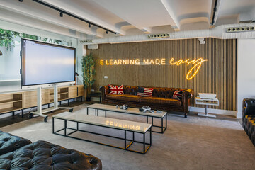 Modern eLearning Lounge with Neon Sign and Stylish Decor