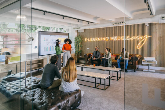 Modern office presentation with diverse team