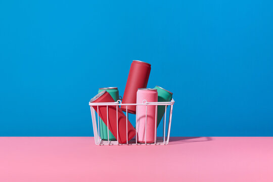 a whole shopping basket with soft drink cans
