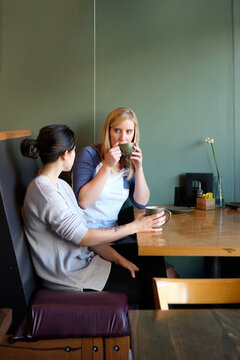 Gay couple hanging out at cafe together 