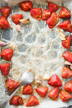Roasted Tomatoes and Garlic on Baking Sheet