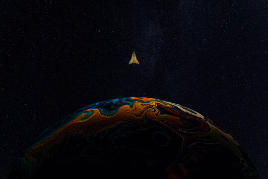 Space shuttle orbiting colorful planet in starry space