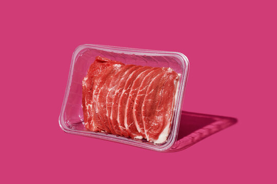 raw beef fillets in a plastic container