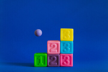 Сolorful plastic cubes with numbers lined up 