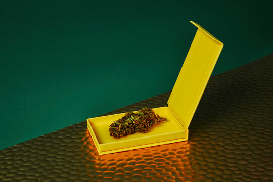 yellow box with a cannabis bud
