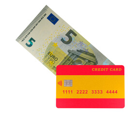 A plastic credit card with the image of the Spanish flag lies on a 5 euro banknote (close-up on a transparent background)